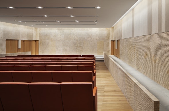 The Comcast Auditorium features limestone walls and leather seats.